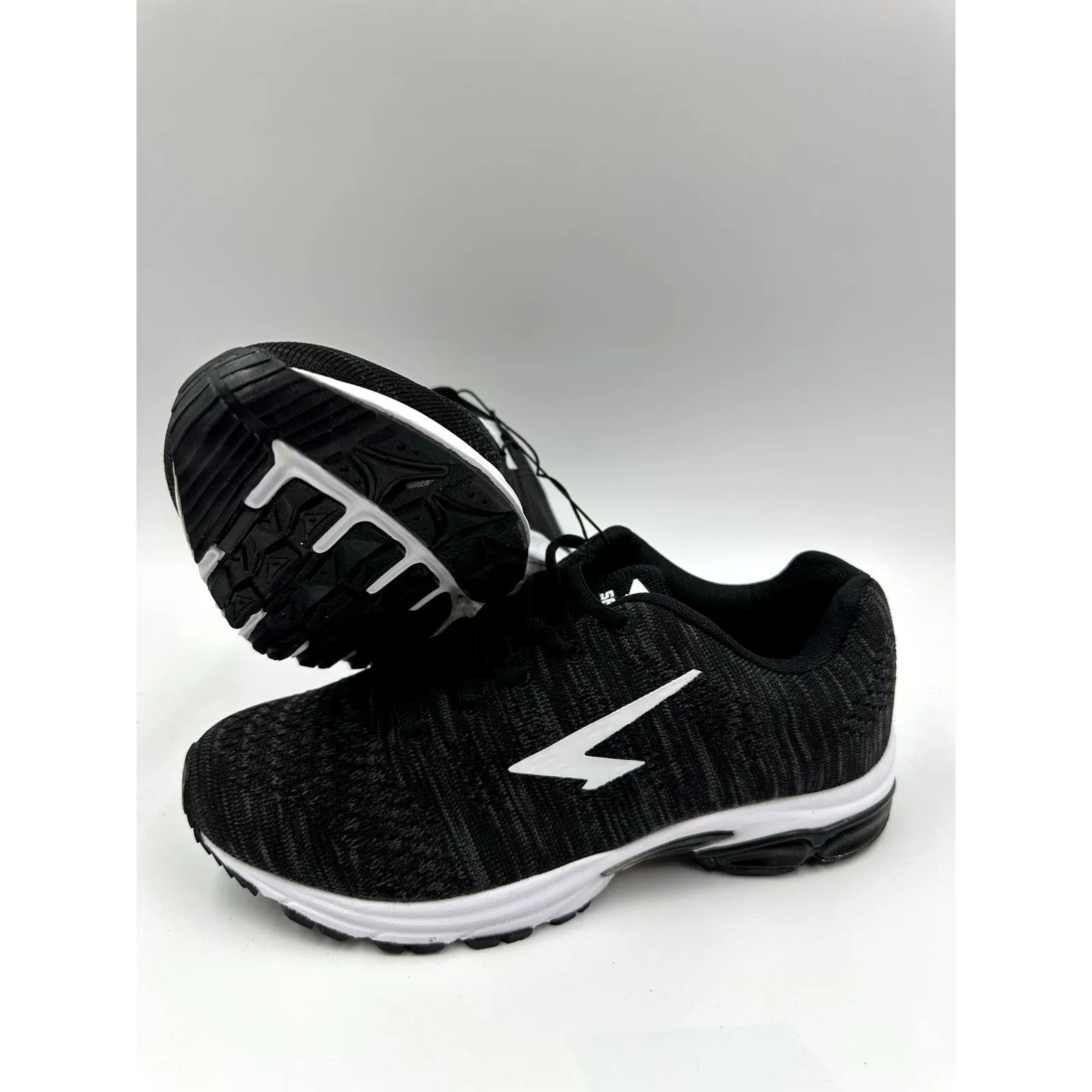 Women's Size 7.5, Black Sneaker with White Accent and Tread Designed for Running