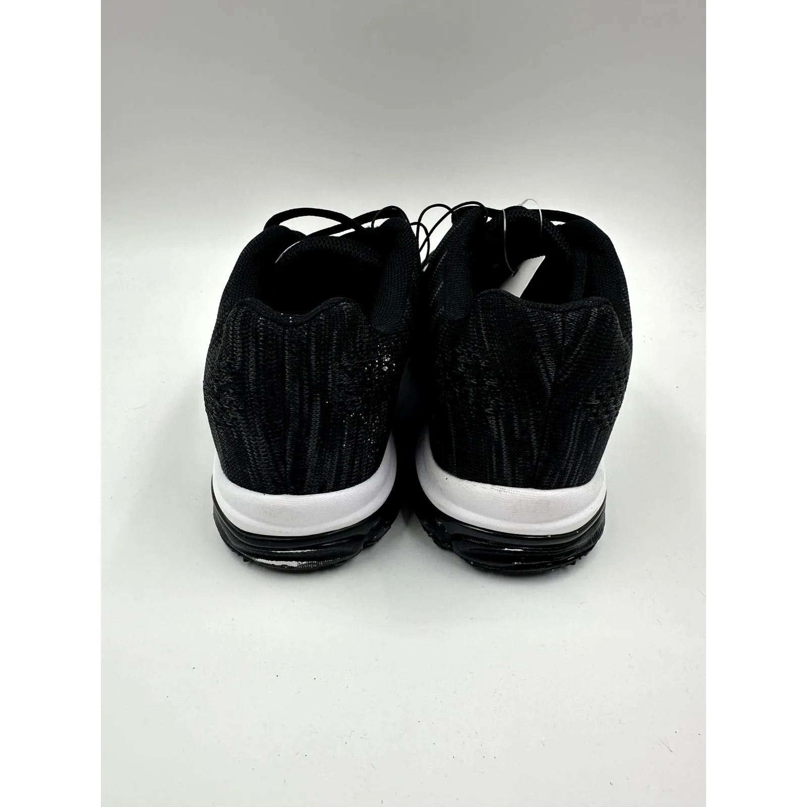 Women's Size 7.5, Black Sneaker with White Accent and Tread Designed for Running