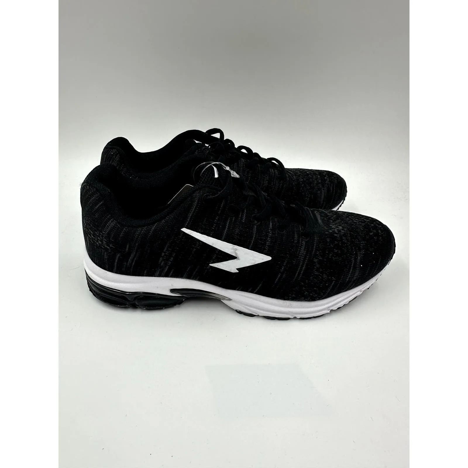 Women's Size 7.5, Black Sneaker with White Accent and Tread Designed for Running