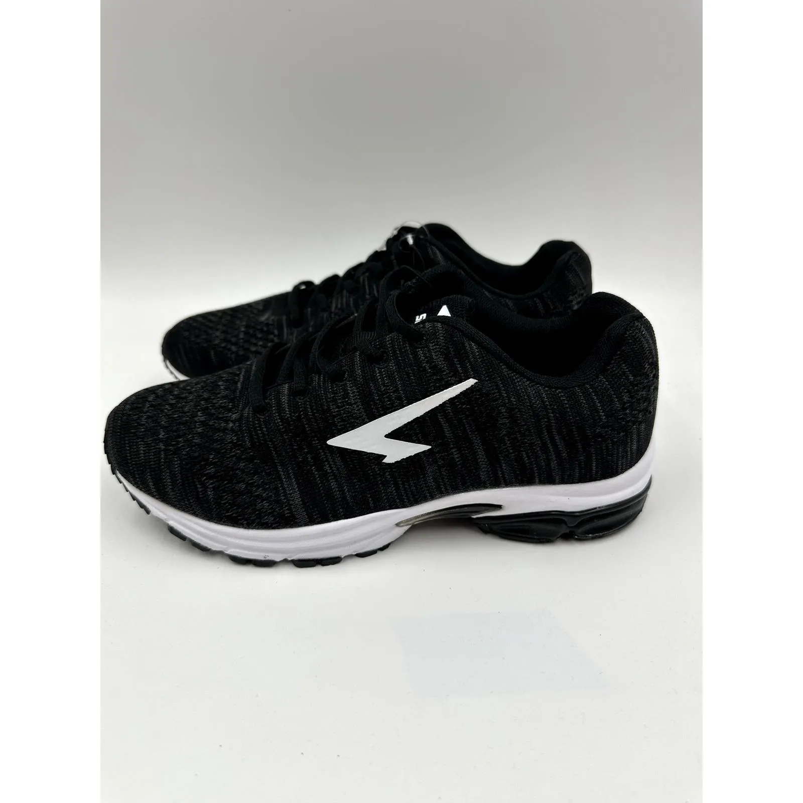 Women's Size 7.5, Black Sneaker with White Accent and Tread Designed for Running